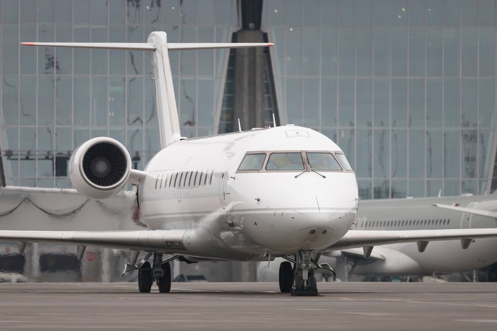 White aircraft at a terminal