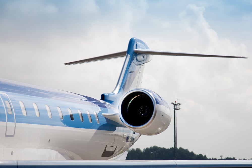 Jet tail and engine against cloud