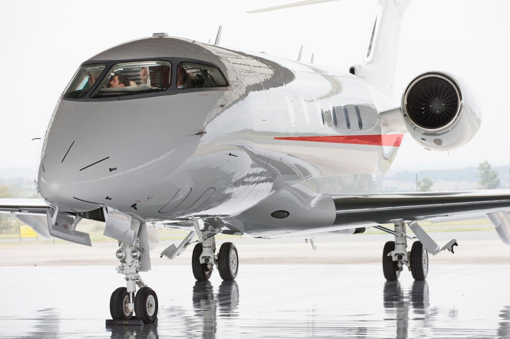 Business jet on a wet hangar floor