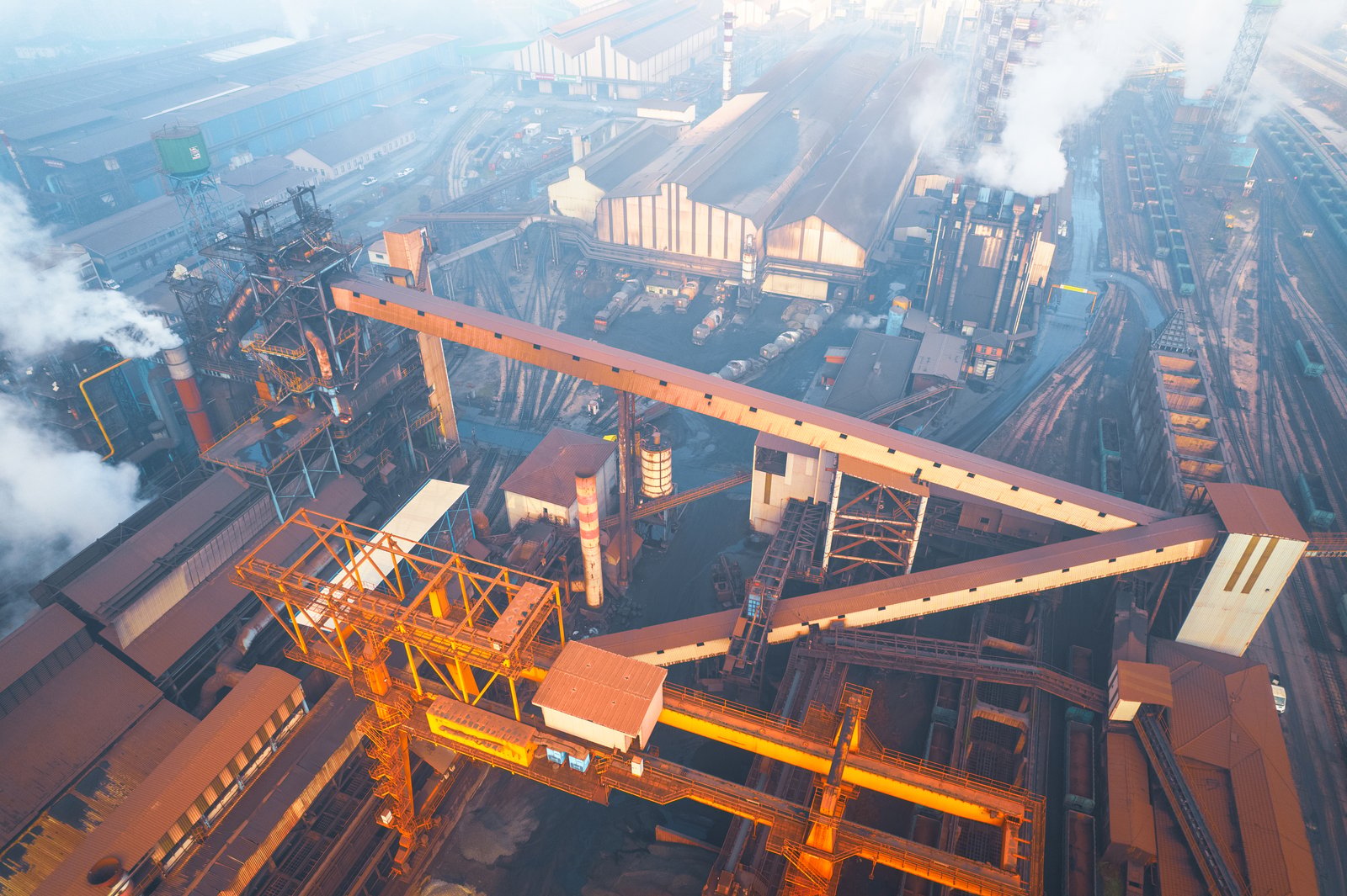 Aerial view of an integrated steel works with conveyors and rail yards