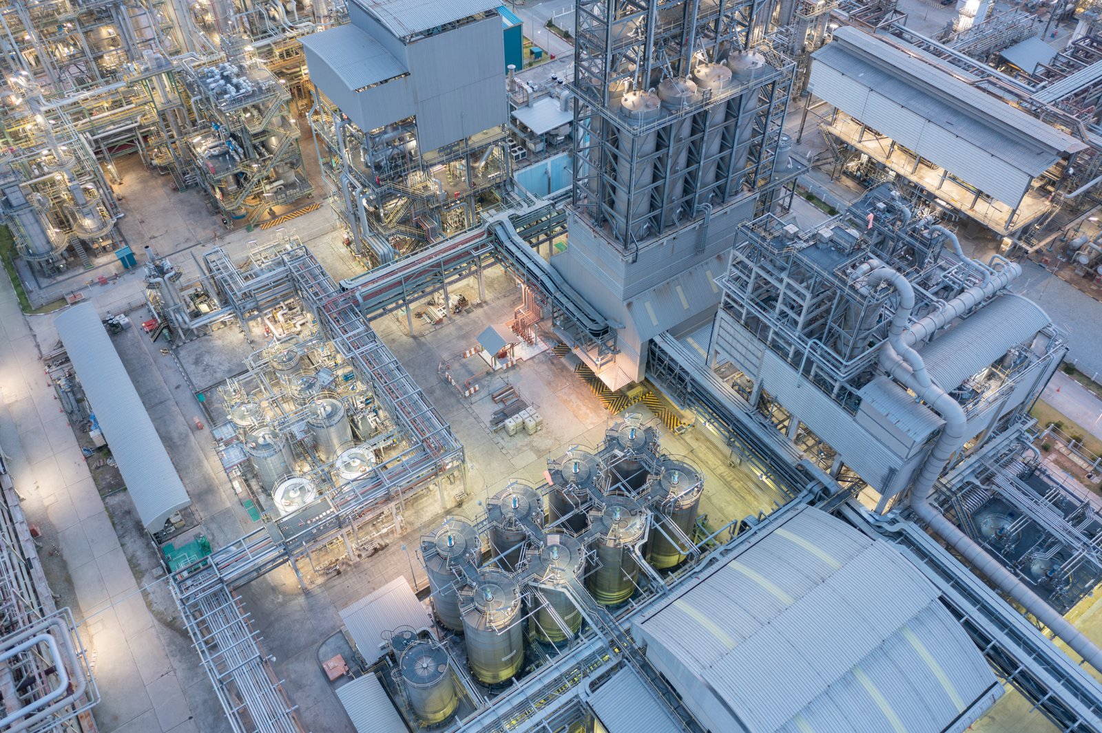 Aerial view of a process plant lit at dusk