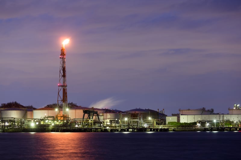 Refinery flare tower at night