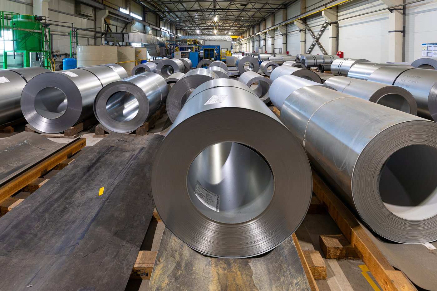 Rows of finished steel coils in a warehouse