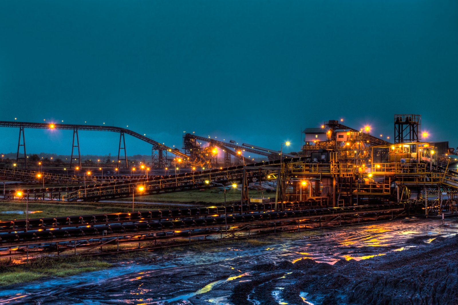 Processing plant conveyors lit at night
