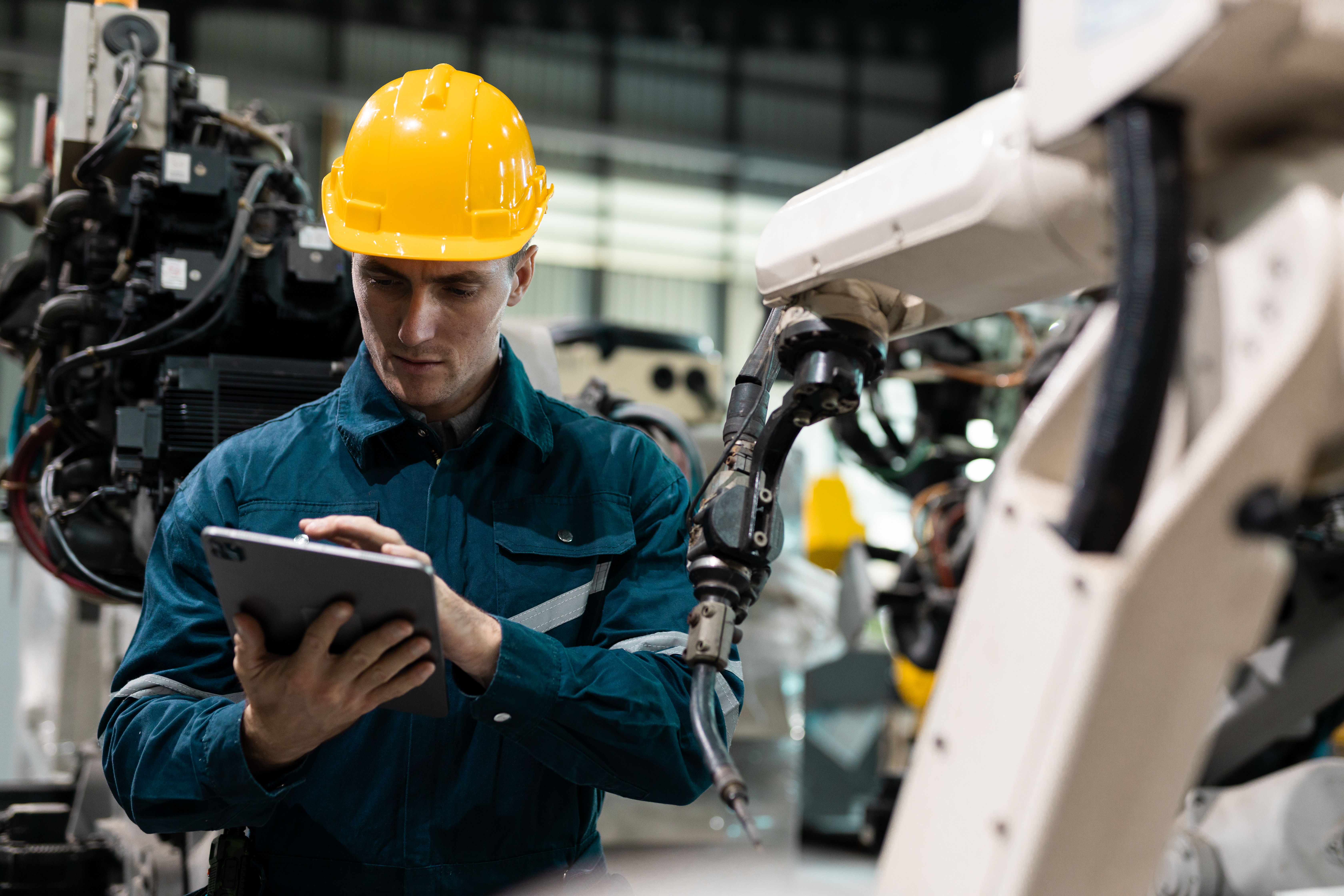 engineer with iPad working in manufacturing